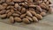 Almonds rotating on wooden table close up