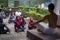 ALMORA, INDIA - SEPTEMBER 02, 2020: Young man wearing a white dhoti taking yoga classes of young kids and older men