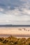 Alnmouth Beach with people walking