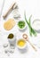 Aloe face mask ingredients -aloe, yogurt, egg, olive oil and beauty accessories on light background, top view. Home recipe.