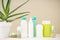Aloe vera and composition of body care and beauty products on a beige background, close-up