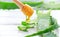 Aloe Vera with honey closeup on white wooden background. Sliced Aloevera natural organic renewal cosmetics
