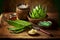 aloe vera leaves and preparation of homemade cosmetics on wooden table
