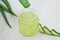 Aloe vera transparent essence with fresh leaves.