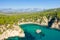 Alonaki Fanariou sandy beach and its green rocky cliffs , in Europe, Greece, Epirus, towards Igoumenitsa, by the Ionian sea, in