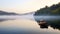 alone boat gliding on a misty lake