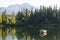 alone boat on mountain lake in early morning