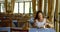 Alone brunette woman is eating dinner meal in daytime in restaurant