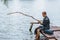 Alone businessman fishing on lost island