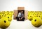 Alone desperate businessman in the middle of happy smileys . 3D Rendering