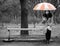 Alone girl sitting at bench