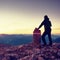 Alone hiker against of Austria Germany border stone on Alpine mountain.