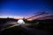 Alone illuminated tent in mountains at night.