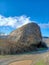 Alone large stone in valley of mountains