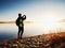 Alone man at the seaside using cell phone to take selfie photo with the sea behind him