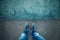 Alone man standing on blue grunge asphalt floor