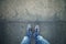 Alone man standing on orange grunge asphalt floor