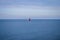 Alone sailing boat floating over baltic sea