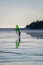 An alone surfer ice boarding on the frozen sea