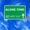 ALONE TIME road sign against clear blue sky