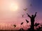 Alone woman praying and free bird flying to the dramatic sky background