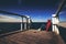 Alone Woman in Red Shirt at the Edge of Pier