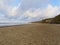 Along the soft sand of Happisburgh beach in the early evening