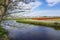 Along the tree that hangs over the water cant you see here the typically Dutch bulb fields around the town of Lisse with yellow da