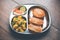 Aloo Fry OR Bombay potatoes and puri/Poori in a stainless steel oval plate