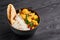 Aloo gobi with rice and chapati. Indian cuisine vegetarian curry at black wooden background