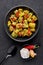 Aloo Methi in black bowl at dark slate background. Aloo Methi is indian cuisine dish