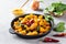 Aloo Palak sabzi or Spinach Potatoes curry served in a frying pan. Popular Indian healthy recipe