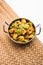 Aloo shimla mirch sabji or dry Potato Capsicum curry is an indian main course recipe