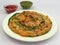 Aloo tikki chaat Indian street food served with chole