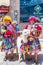 Alpaca and women in traditional clothes in Pisaq, Peru