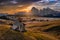 Alpe di Siusi, Italy - Aerial panoramic view of a wooden cottage at Seiser Alm, a Dolomite plateau in Dolomites, South Tyrol