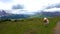 Alpe di Siusi, Seiser Alm with Sassolungo Langkofel Dolomite, cows on the meadow