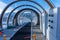 Alpes d'Huez, France - 31.12.2021: Magicagic carpet ski lift in a glass tunel. Snowy winter day in the french ski