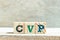 Alphabet block in word CVP Abbreviation of Cost Volume Profit or Central venous pressure on wood background