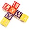 Alphabet Blocks Spelling Love In Criss Cross Style