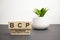 Alphabet letter block in word BCP abbreviation business continuity plan on wood background