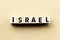 Alphabet letter block in word israel on wood background