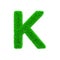 Alphabet letter K uppercase. Grassy font made of fresh green grass. 3D render isolated on white background.