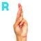 Alphabet letter R in sign language for the deaf . ASL. Hand gesture letter R on a white