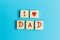 Alphabet on small plate on Blue background for Father â€™s day