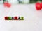 Alphabet `Sunday` beads in cube shape with blurred background ,block letters ,happy holiday wallpaper or text ,colorful characters