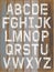 Alphabet white color paint on wood retro color background.