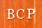 Alphabet in word BCP abbreviation business continuity plan on old red color wood plate background
