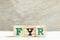 Alphabet in word FYR abbreviation of for your reference on wood background