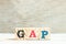 Alphabet in word GAP abbreviation of good agricultural practice on wood background